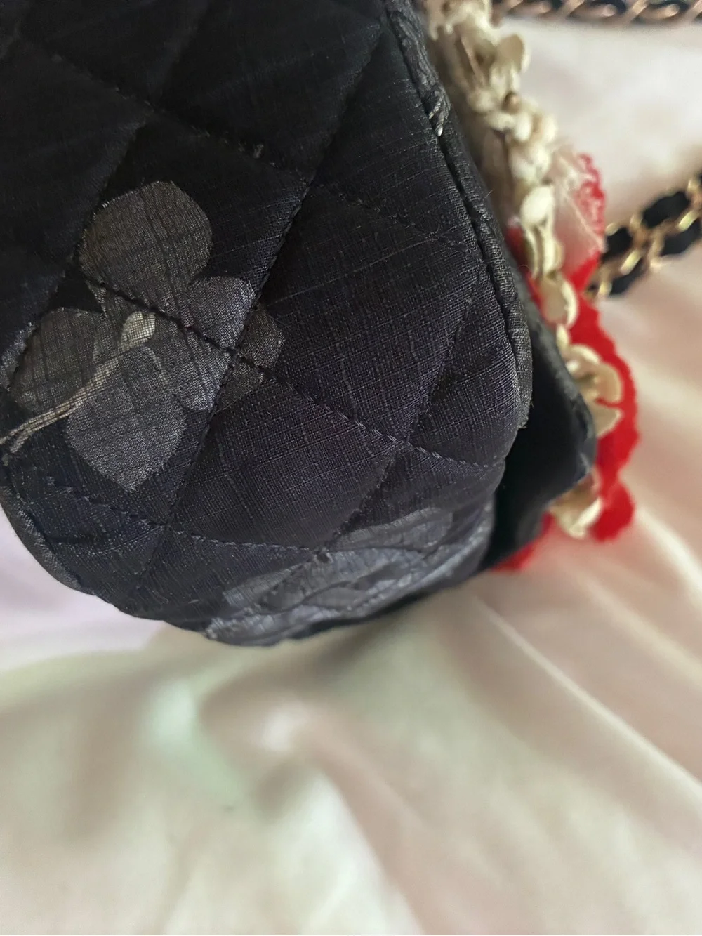 CHANEL Black Quilted Shoulder Bag with Red Floral Appliqués